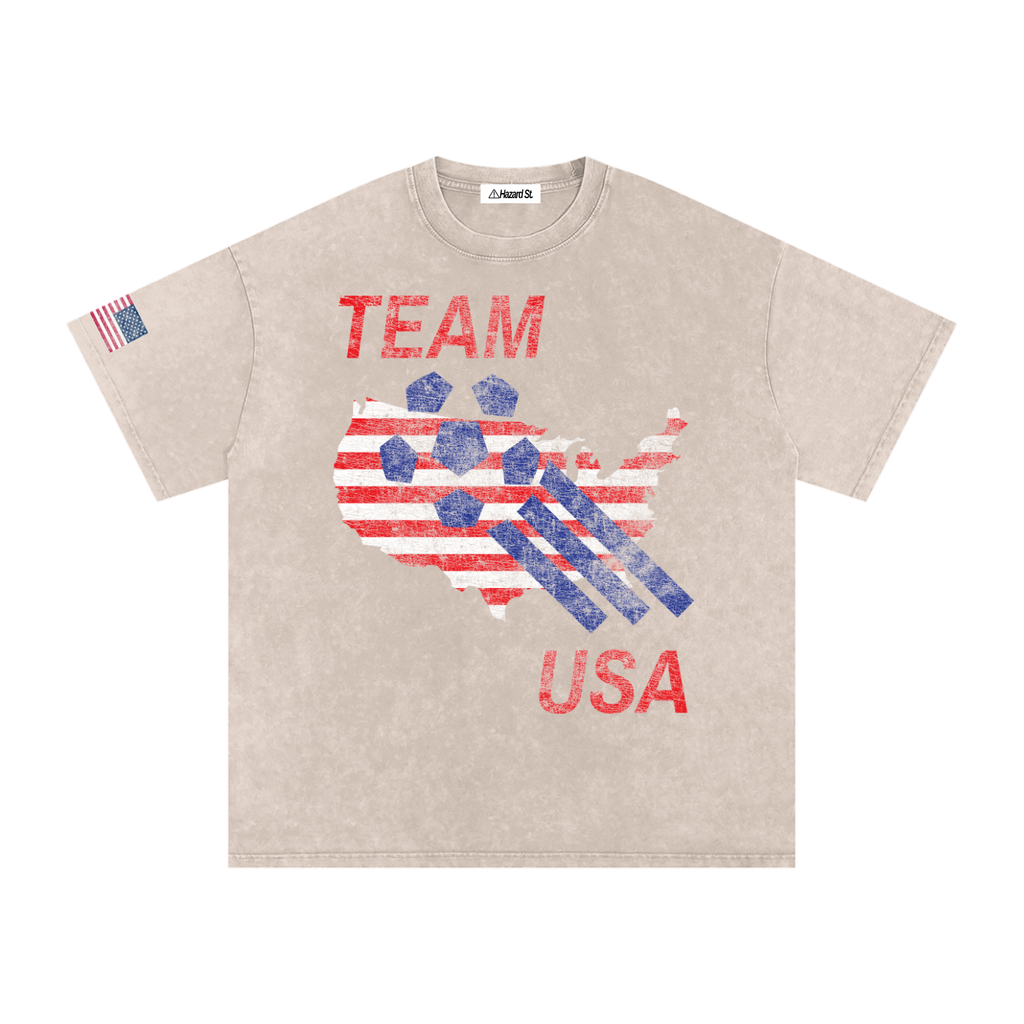 apricot vintage style shirt with outline of the united states with distressed soccer ball flying over it with words team usa on it featuring american flag on the sleeve